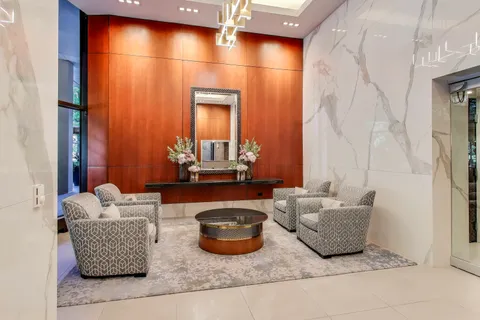 a view of washer and dryer with kitchen in the background