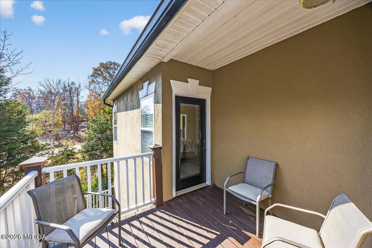 518 River Overlook Forsyth, GA 31029 - Photo 62 of 96 a view of a chair and table in the balcony