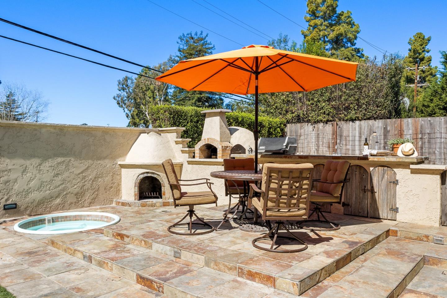 105 Wesley Street Capitola, CA 95010 - Photo 44 of 55 a view of a chairs and table in backyard