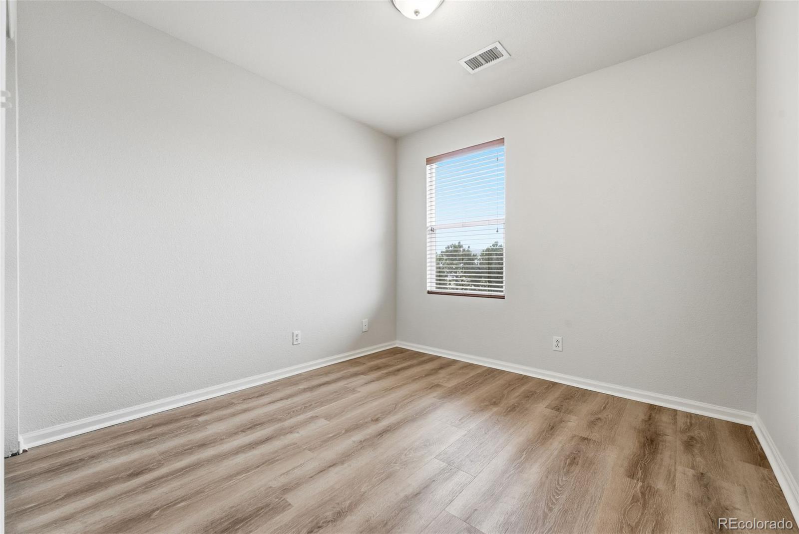 5811 Ceylon Street Denver, CO 80249 - Photo 33 of 43 an empty room with a window