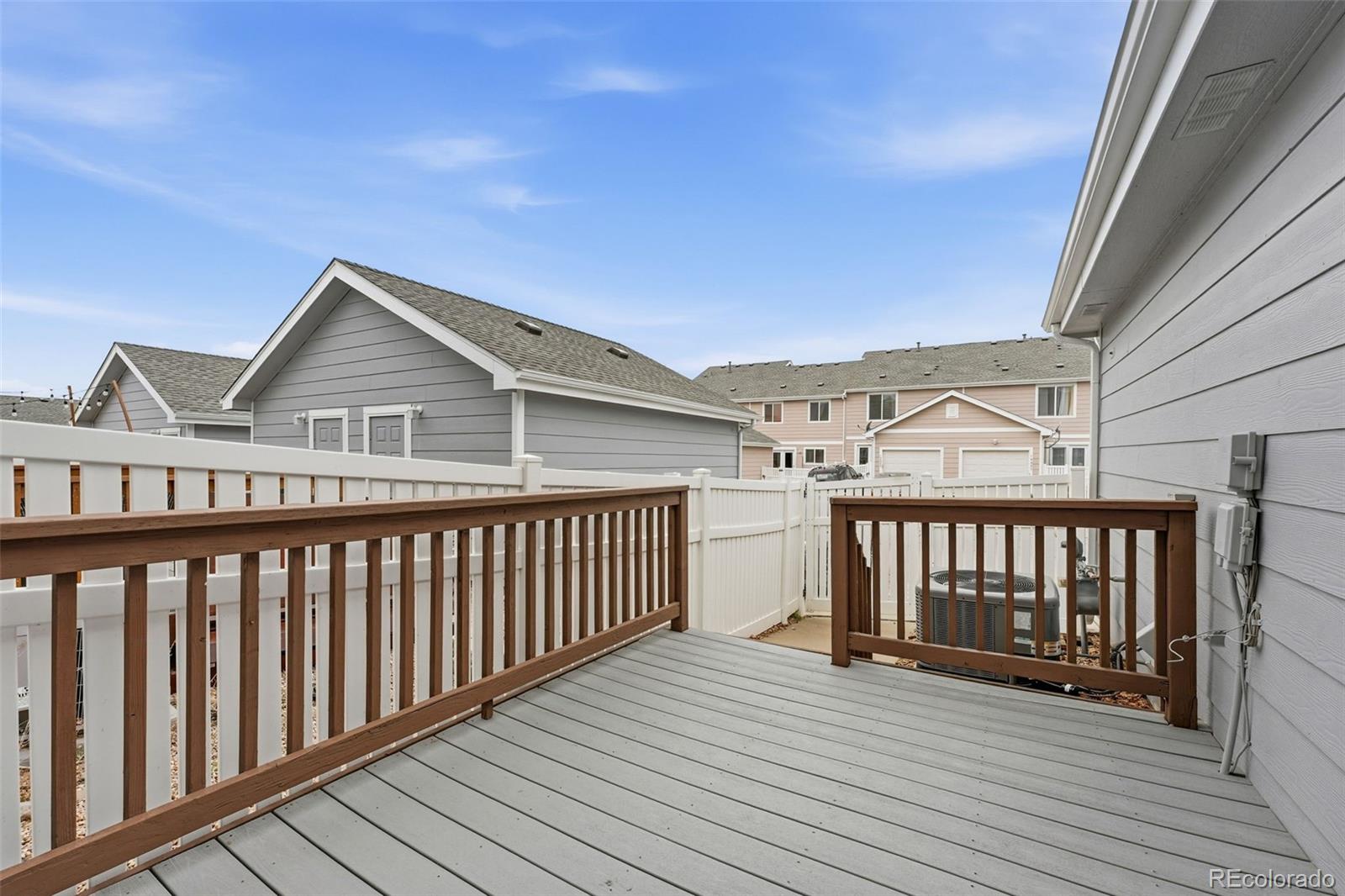 5811 Ceylon Street Denver, CO 80249 - Photo 36 of 43 a view of a balcony with wooden floor
