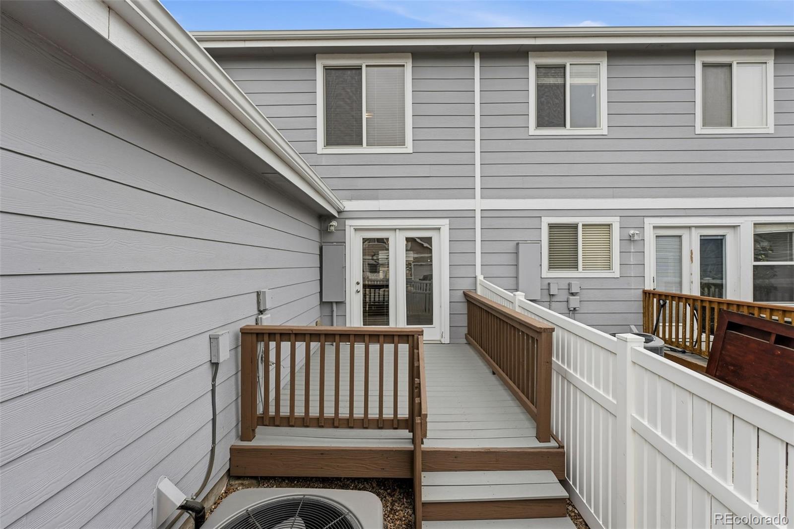 5811 Ceylon Street Denver, CO 80249 - Photo 39 of 43 a view of a house with wooden deck
