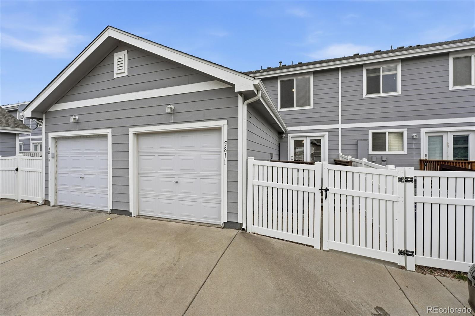5811 Ceylon Street Denver, CO 80249 - Photo 40 of 43 a front view of a house with a garage