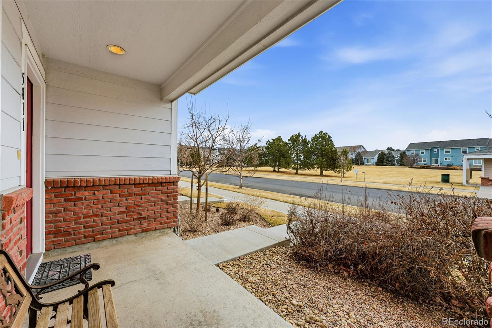 5811 Ceylon Street Denver, CO 80249 - Photo 5 of 43 a view of a swimming pool with an outdoor seating and a yard