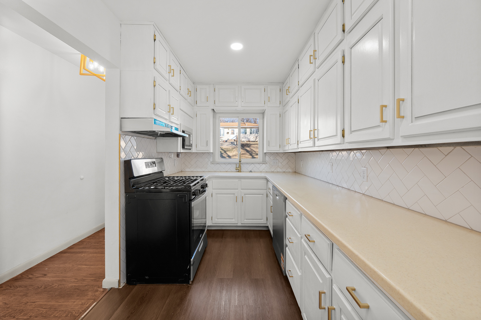 2518 13th Street Rock Island, IL 61201 - Photo 12 of 37 a kitchen with cabinets and a stove