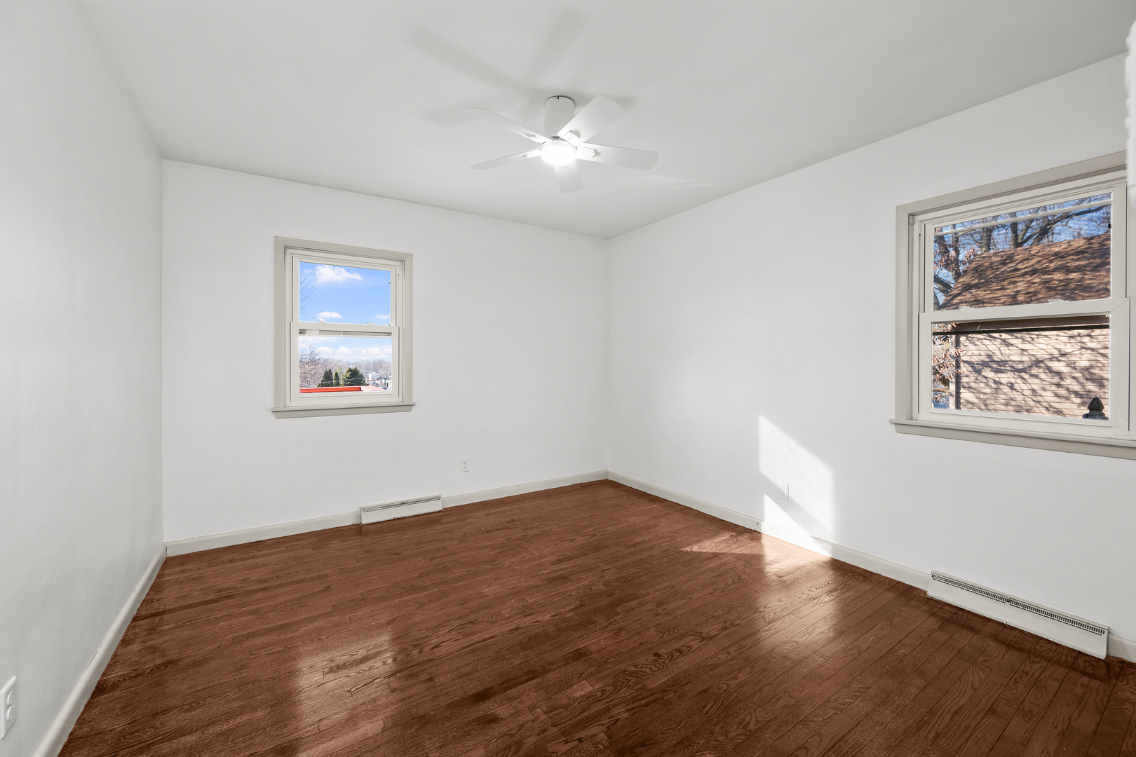 2518 13th Street Rock Island, IL 61201 - Photo 18 of 37 a view of an empty room with wooden floor and a window