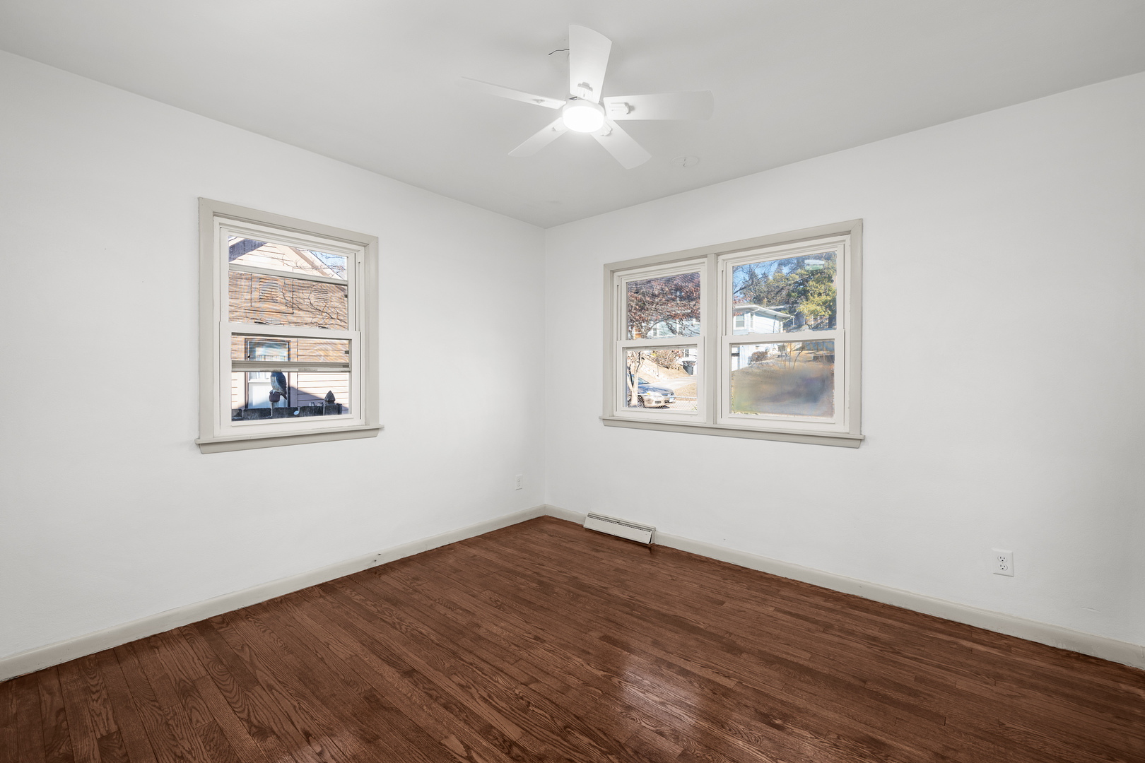 2518 13th Street Rock Island, IL 61201 - Photo 20 of 37 a view of empty room with wooden floor and fan