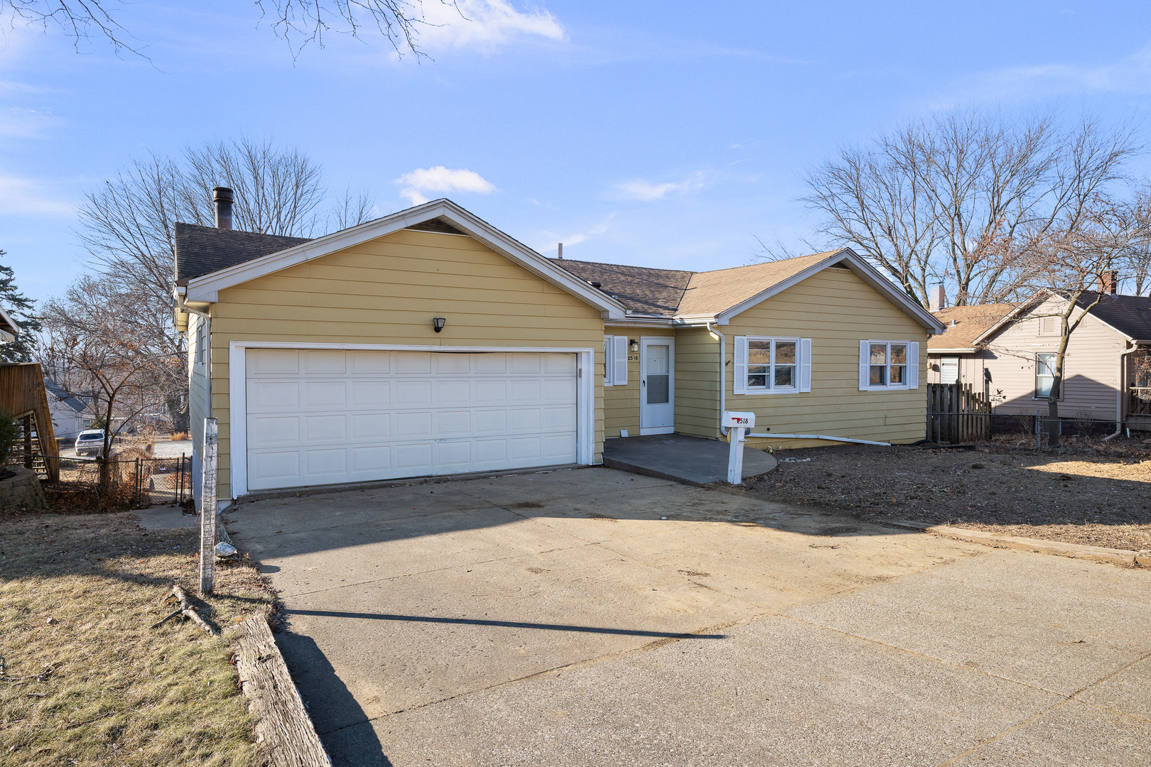 2518 13th Street Rock Island, IL 61201 - Photo 2 of 37 a front view of a house with a yard and garage