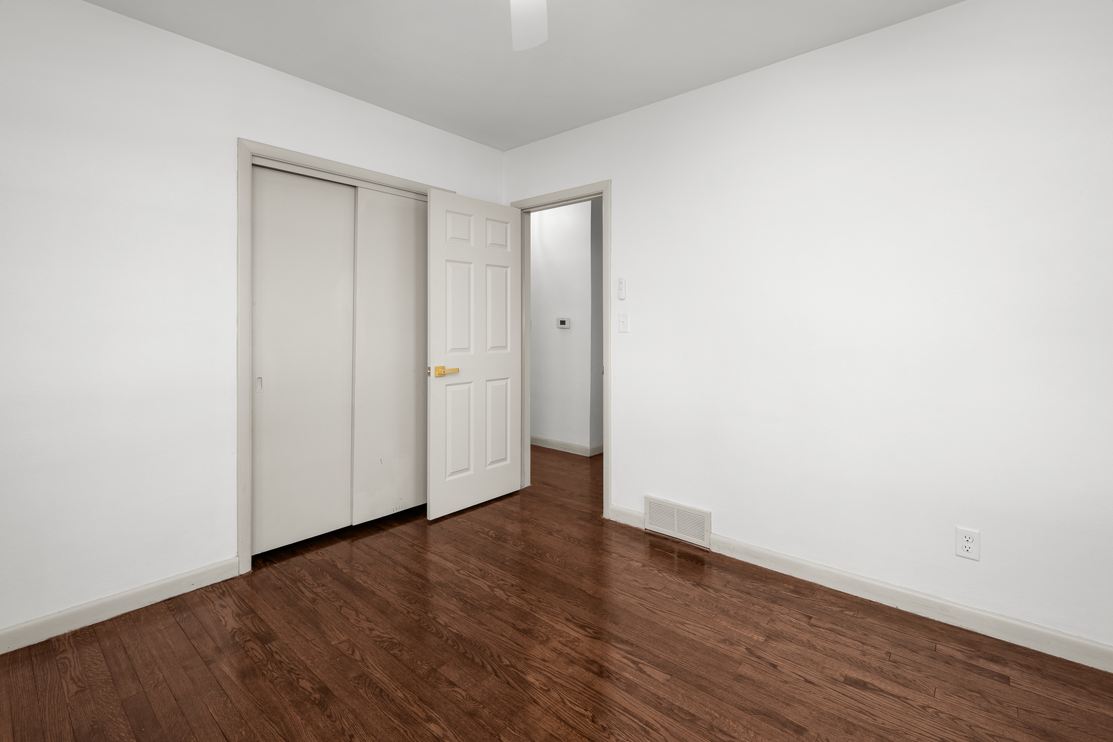 2518 13th Street Rock Island, IL 61201 - Photo 21 of 37 a view of an empty room with wooden floor and closet