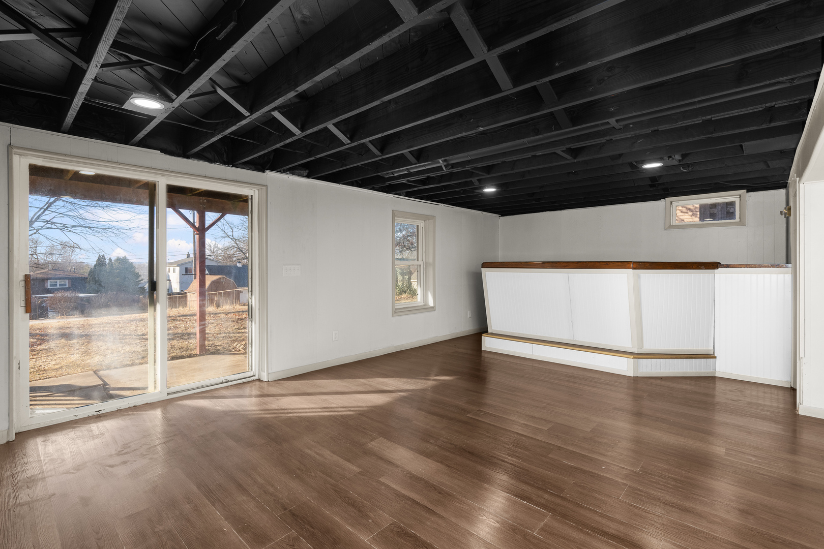2518 13th Street Rock Island, IL 61201 - Photo 23 of 37 a view of an empty room with wooden floor and a window
