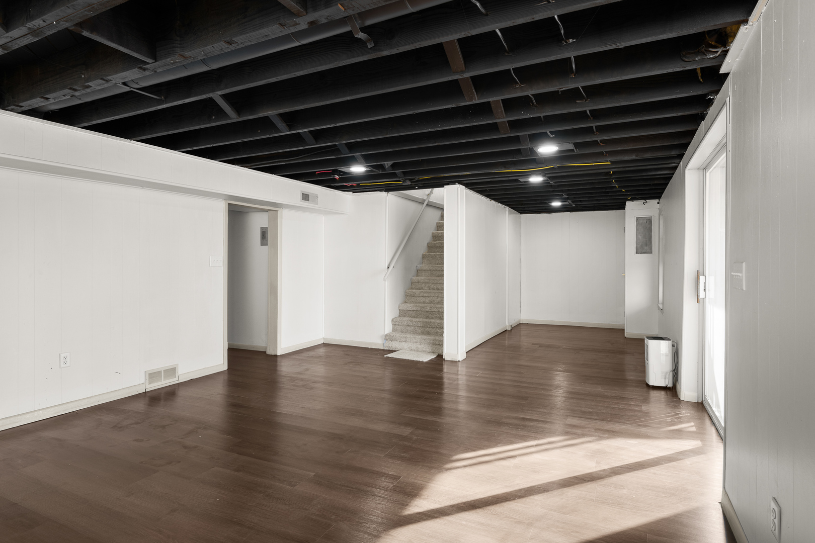 2518 13th Street Rock Island, IL 61201 - Photo 25 of 37 a view of water heater room with wooden floor