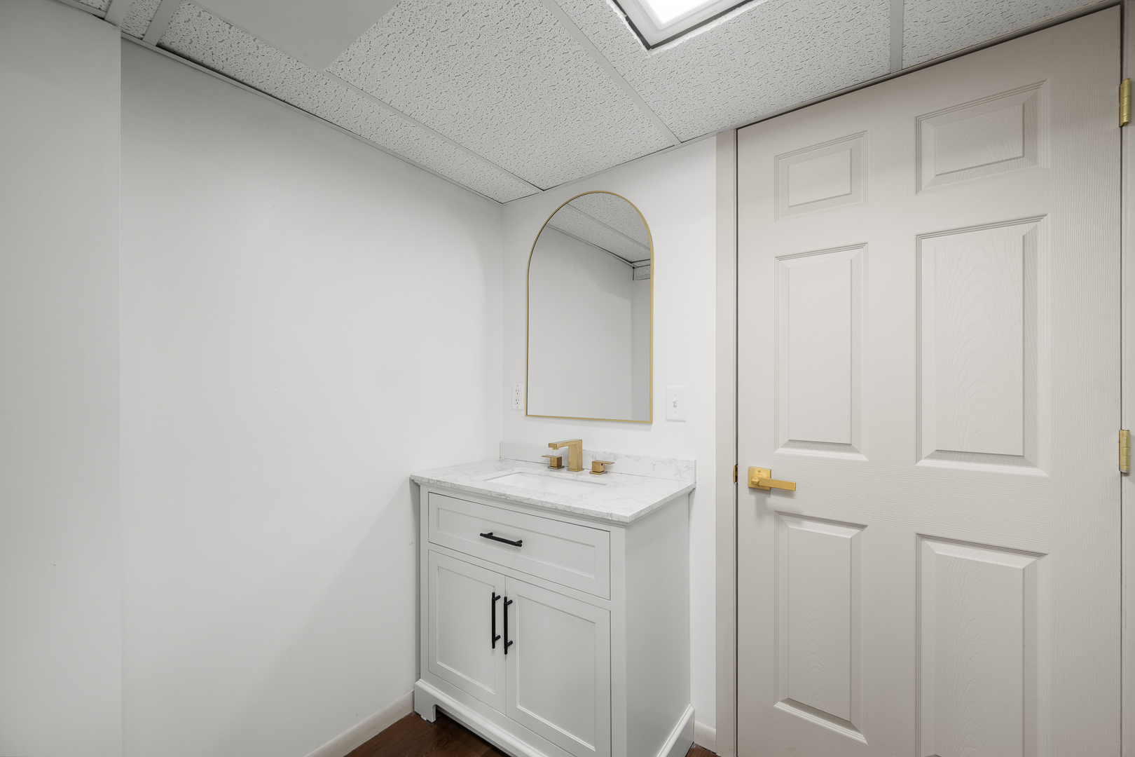 2518 13th Street Rock Island, IL 61201 - Photo 27 of 37 a bathroom with a sink and a mirror