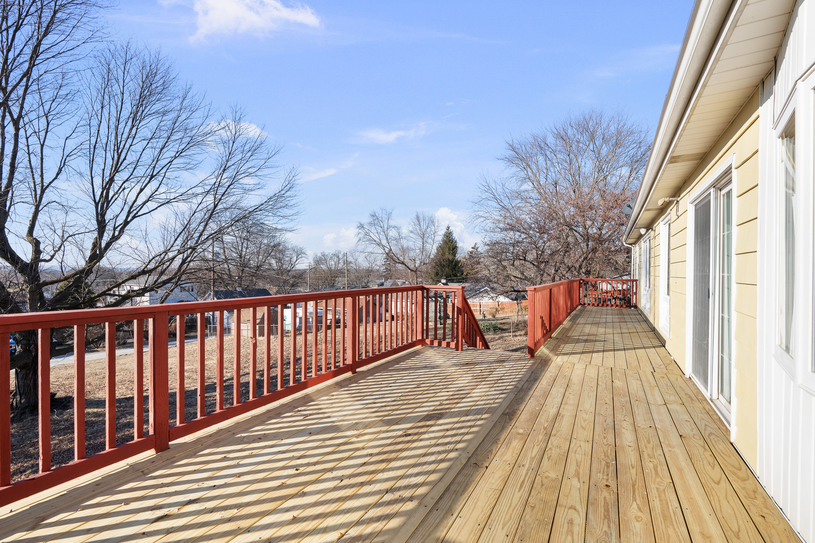 2518 13th Street Rock Island, IL 61201 - Photo 32 of 37 a view of balcony with wooden floor and fence