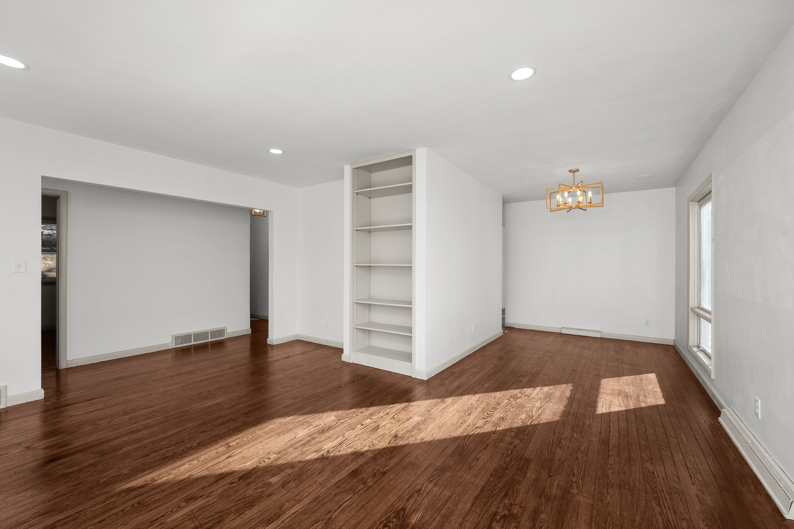 2518 13th Street Rock Island, IL 61201 - Photo 5 of 37 wooden floor in an empty room with a window
