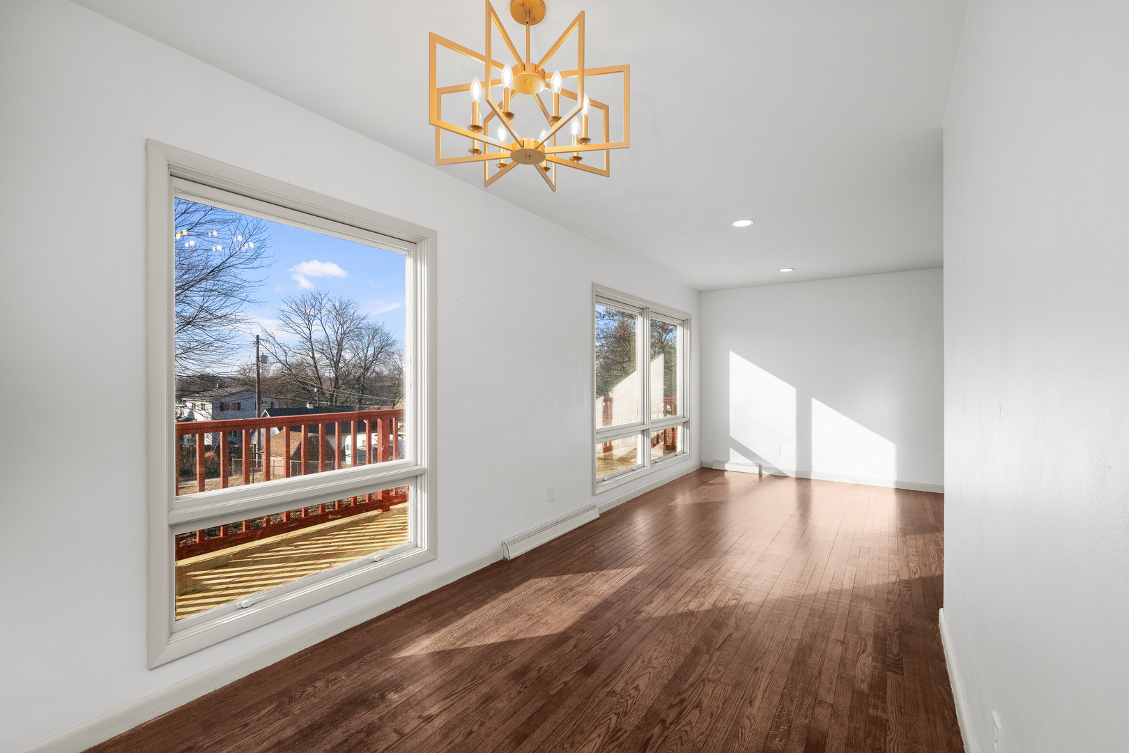 2518 13th Street Rock Island, IL 61201 - Photo 8 of 37 a view of an empty room with wooden floor and a window