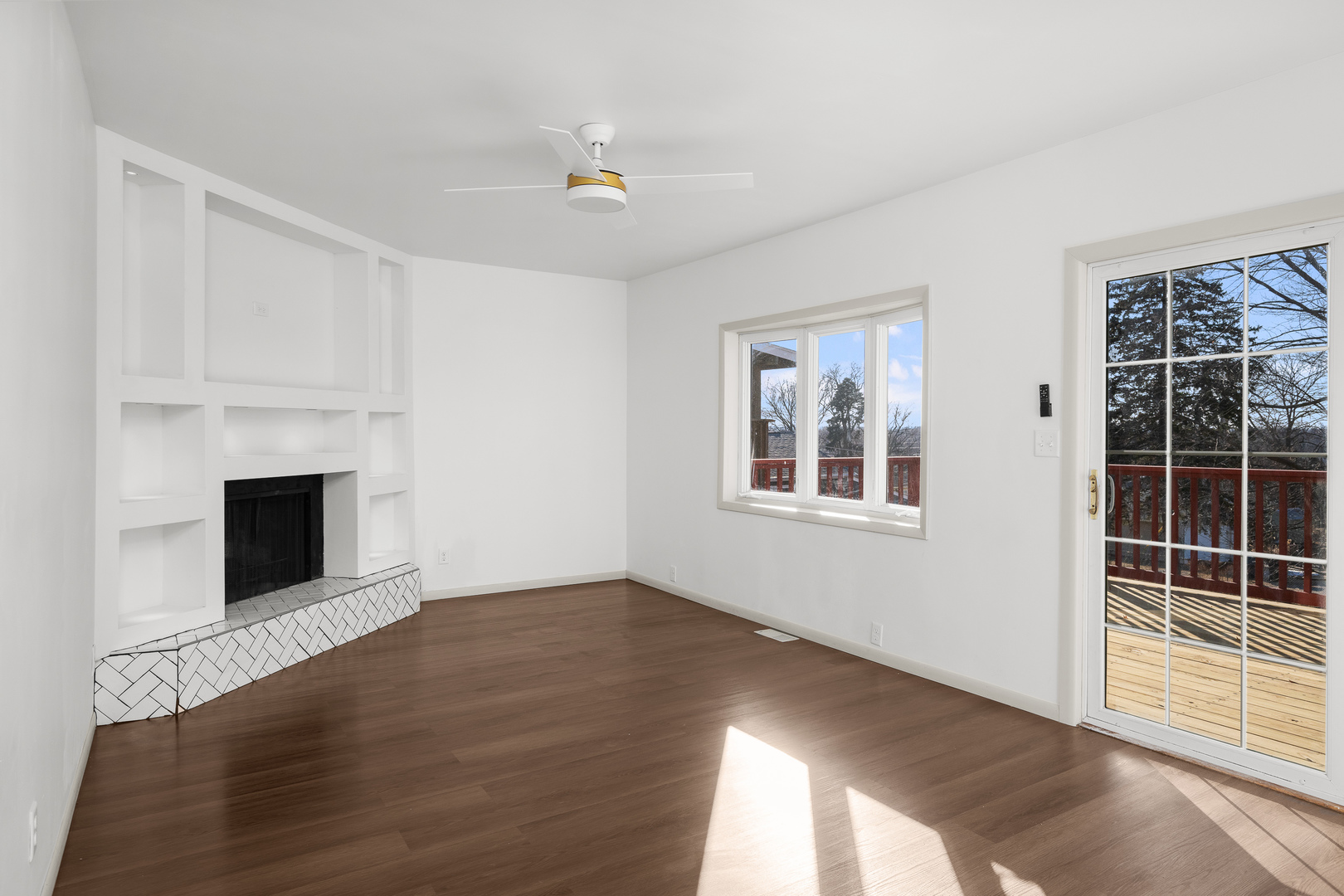 2518 13th Street Rock Island, IL 61201 - Photo 9 of 37 a view of an empty room with wooden floor and a window