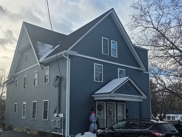 a front view of a house with yard