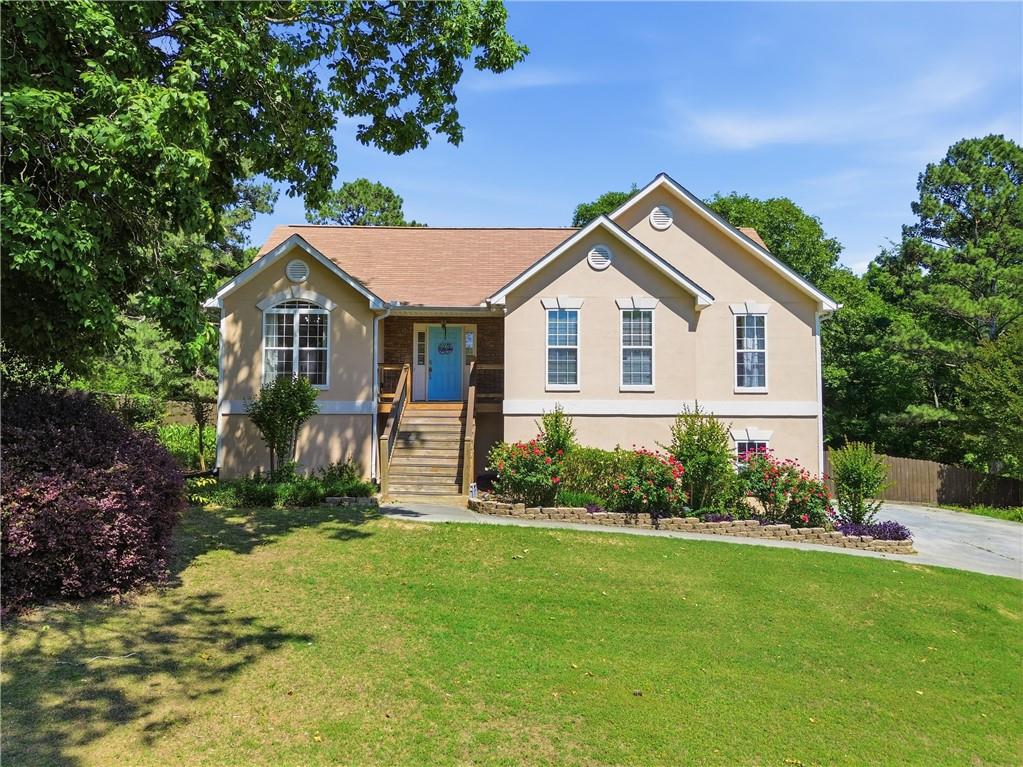 137 Orchard Way Southeast Calhoun, GA 30701 - Photo 2 of 39 a front view of a house with a garden