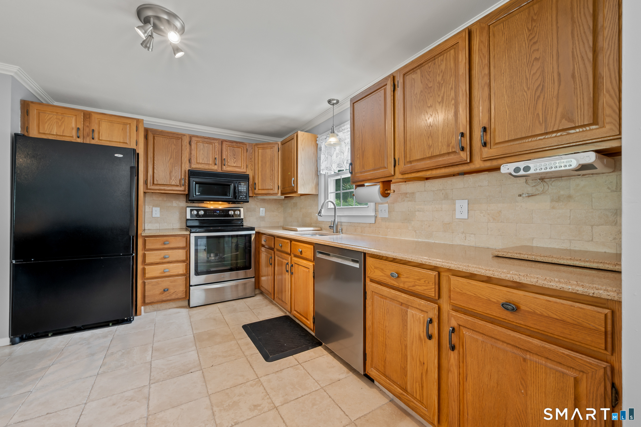 1611 Shepard Avenue Hamden, CT 06518 - Photo 9 of 31 a kitchen with stainless steel appliances granite countertop a refrigerator sink and cabinets