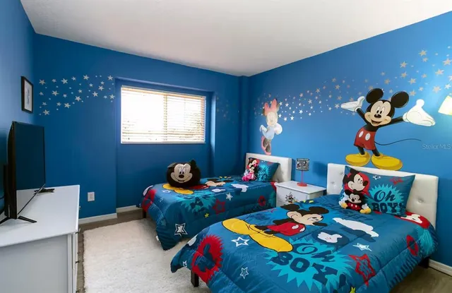 a bathroom with a sink a toilet and shower curtain