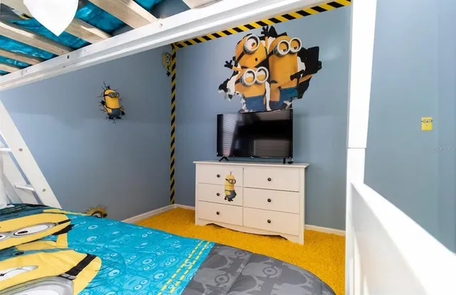 a balcony with furniture and a potted plant