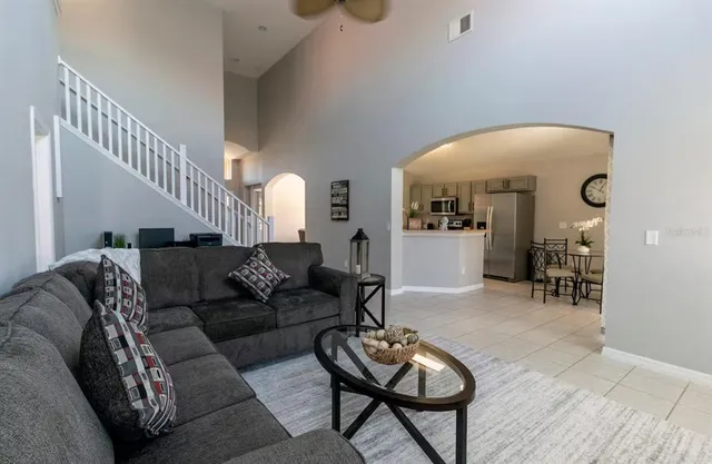 a room with pool table and windows