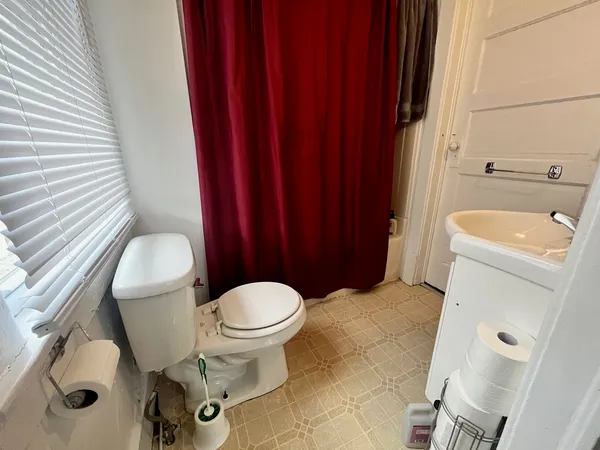 a bathroom with a toilet and a sink
