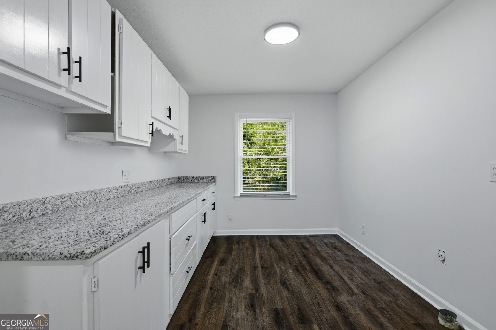 4443 Ritch Haven Road Columbus, GA 31909 - Photo 12 of 42 Huge laundry room has cabinets for storage, granite countertops for folding clothes and plenty of space for a standup freezer or pantry shelves.