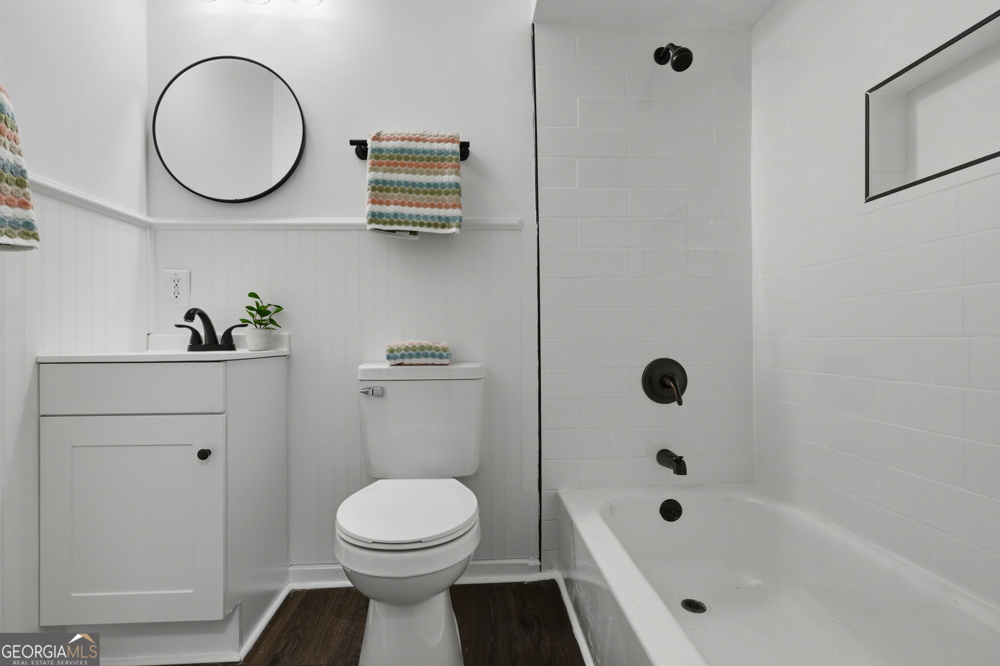 4443 Ritch Haven Road Columbus, GA 31909 - Photo 13 of 42 All new fixtures, vanity, black hardware, mirror and lighting, tile tub surround.