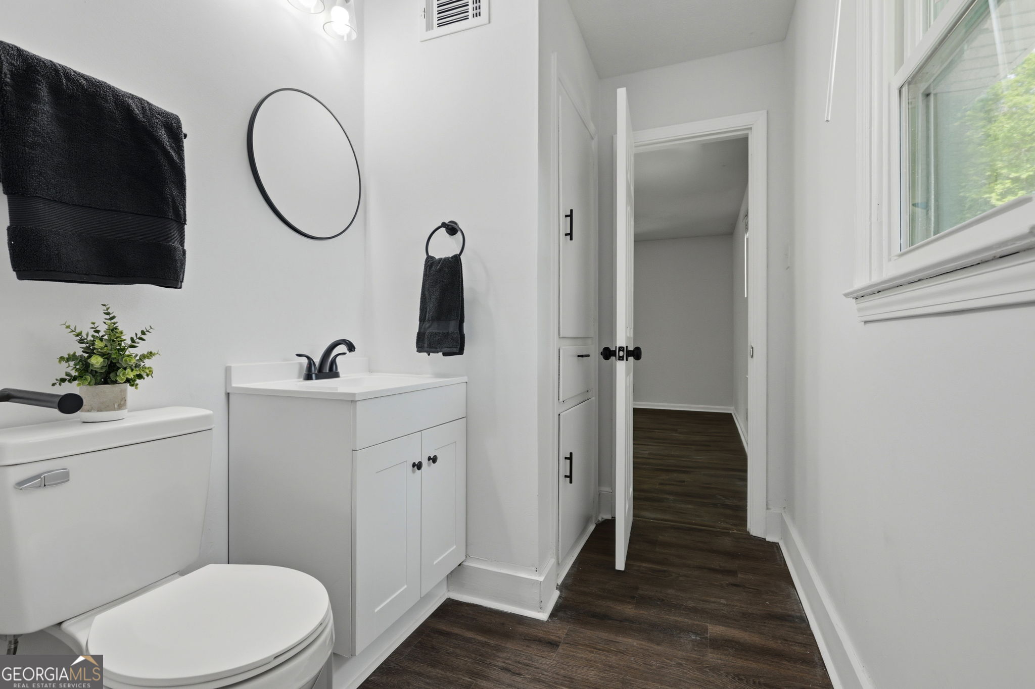 4443 Ritch Haven Road Columbus, GA 31909 - Photo 15 of 42 New toilet, vanity, mirror & lighting, black fixtures and accessories.