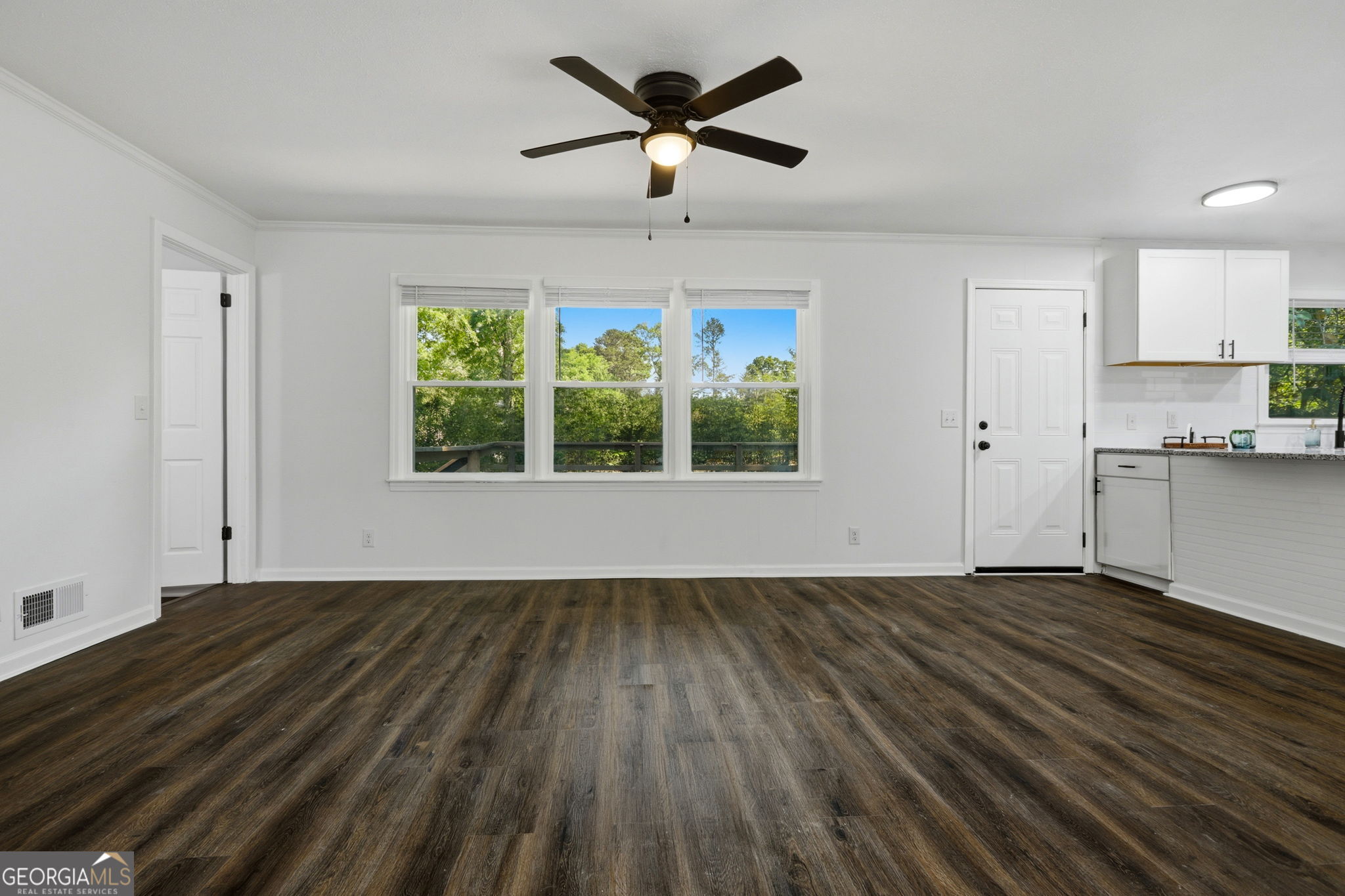4443 Ritch Haven Road Columbus, GA 31909 - Photo 9 of 42 LVP flooring throughout the home. LR is open to the kitchen and the dining room