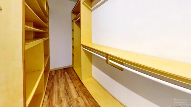 a view of balcony with wooden floor