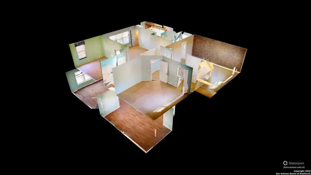 an aerial view of a house with a kitchen