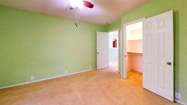 a view of a livingroom with wooden floor and a window