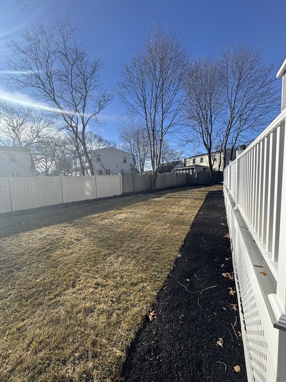 12 Bronx Road Boston, MA 02132 - Photo 22 of 31 a view of a yard with wooden fence