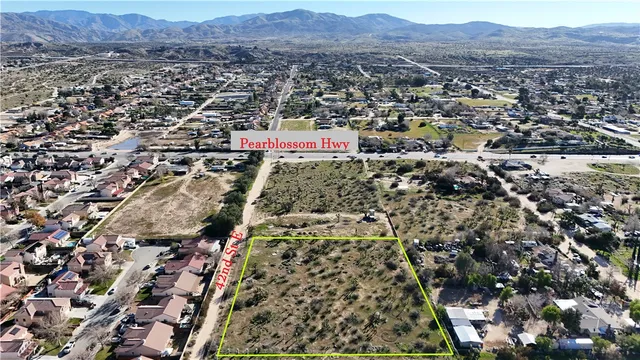 an aerial view of residential houses and city view