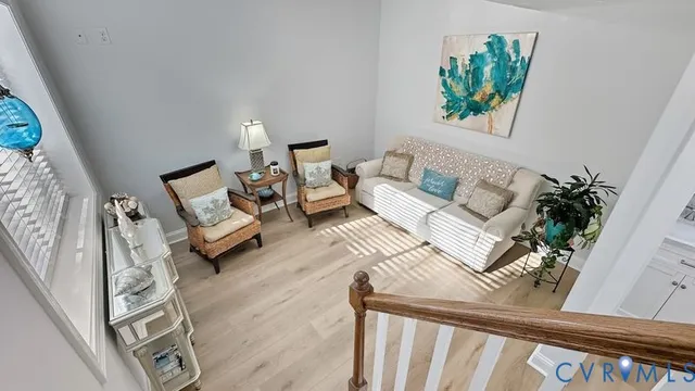 a living room with furniture and a rug