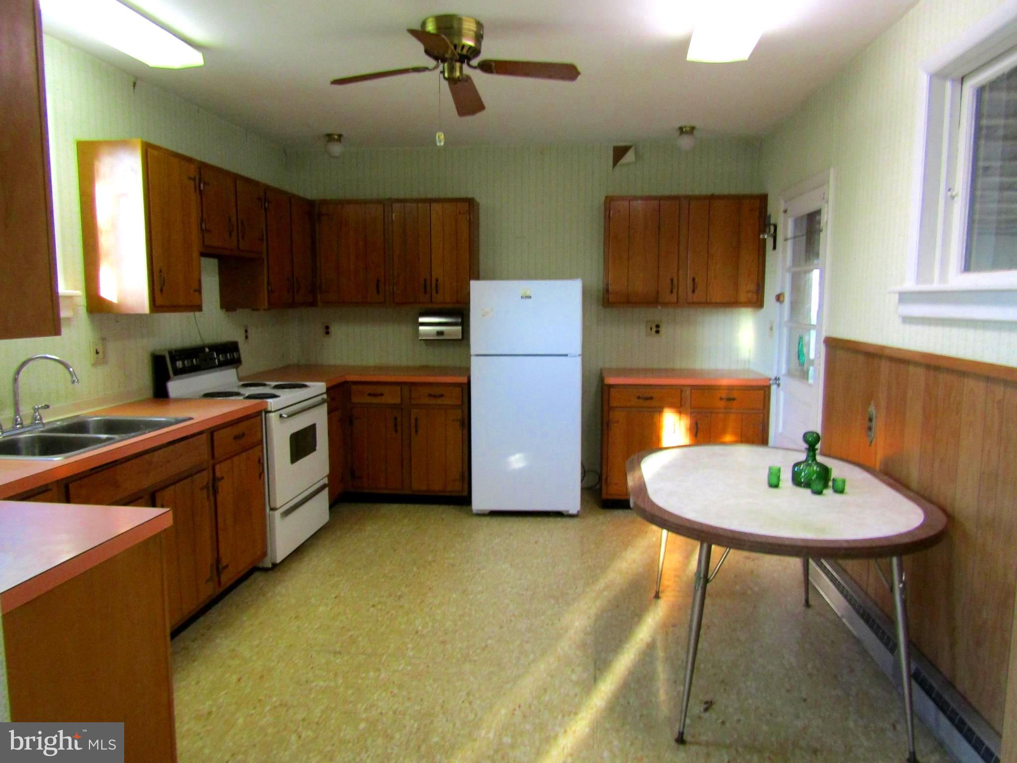 57 Ridge Avenue Coatesville, PA 19320 - Photo 15 of 21 Eat-in kitchen with door to back porch