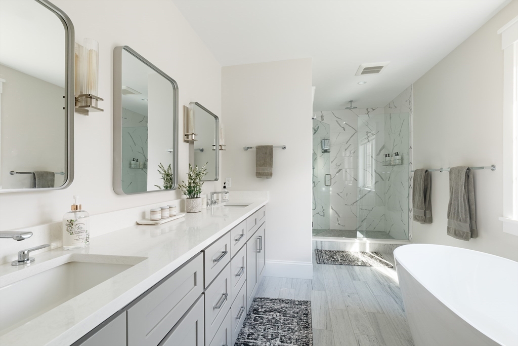 36 Patton Road Wellesley, MA 02482 - Photo 11 of 24 a spacious bathroom with a double vanity sink toilet mirror and bathtub