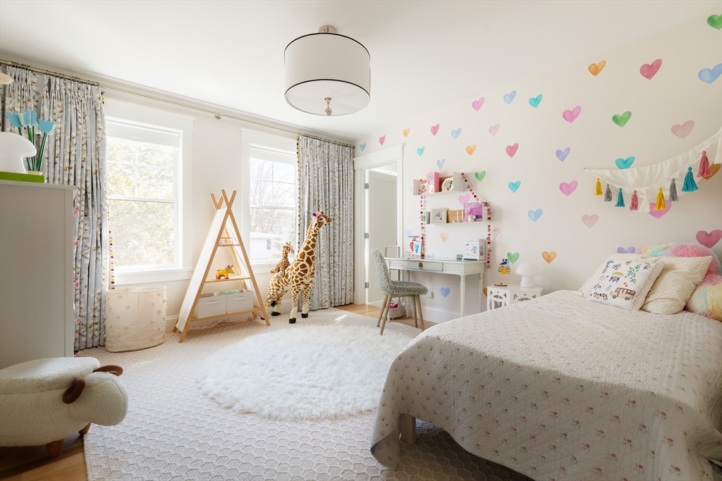 36 Patton Road Wellesley, MA 02482 - Photo 13 of 24 a bedroom with a bed and a chandelier