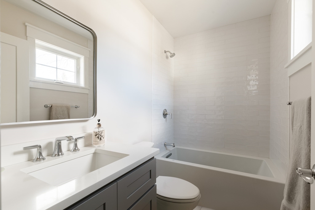 36 Patton Road Wellesley, MA 02482 - Photo 16 of 24 a bathroom with a granite countertop sink a toilet and shower