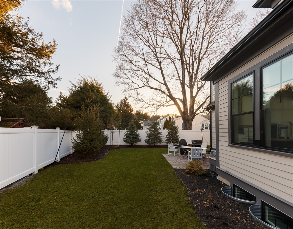 36 Patton Road Wellesley, MA 02482 - Photo 22 of 24 a backyard of a house with table and chairs