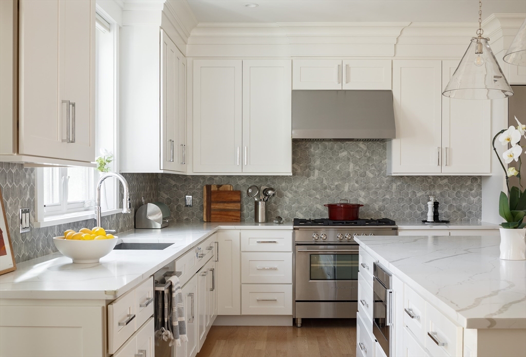 36 Patton Road Wellesley, MA 02482 - Photo 7 of 24 a kitchen with a sink a stove and cabinets
