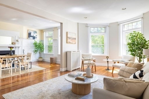 1898 Beacon Street, Unit 4 Brookline, MA 02445 - Photo 1 of 13 a living room with furniture and a large window