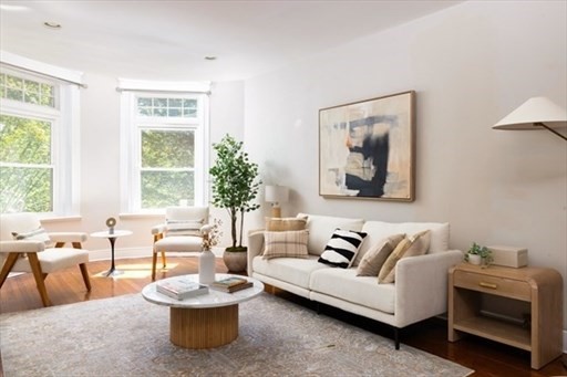 1898 Beacon Street, Unit 4 Brookline, MA 02445 - Photo 2 of 13 a living room with furniture and a large window