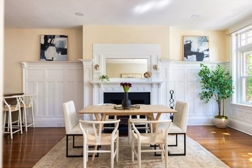 1898 Beacon Street, Unit 4 Brookline, MA 02445 - Photo 3 of 13 a view of a dining room with furniture and wooden floor
