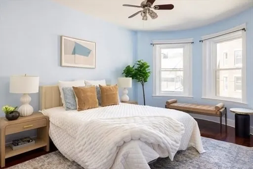 a bedroom with a bed and window