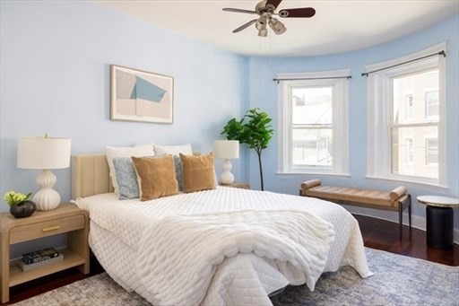 1898 Beacon Street, Unit 4 Brookline, MA 02445 - Photo 8 of 13 a bedroom with a bed and window