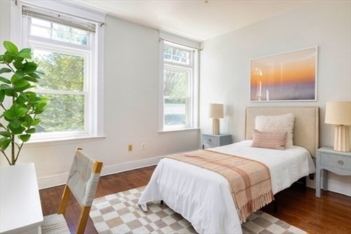 1898 Beacon Street, Unit 4 Brookline, MA 02445 - Photo 9 of 13 a bedroom with a bed and a window