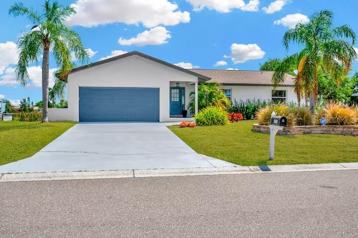 721 Eagle Lane Apollo Beach, FL 33572 - Photo 1 of 48 a front view of house with yard and green space